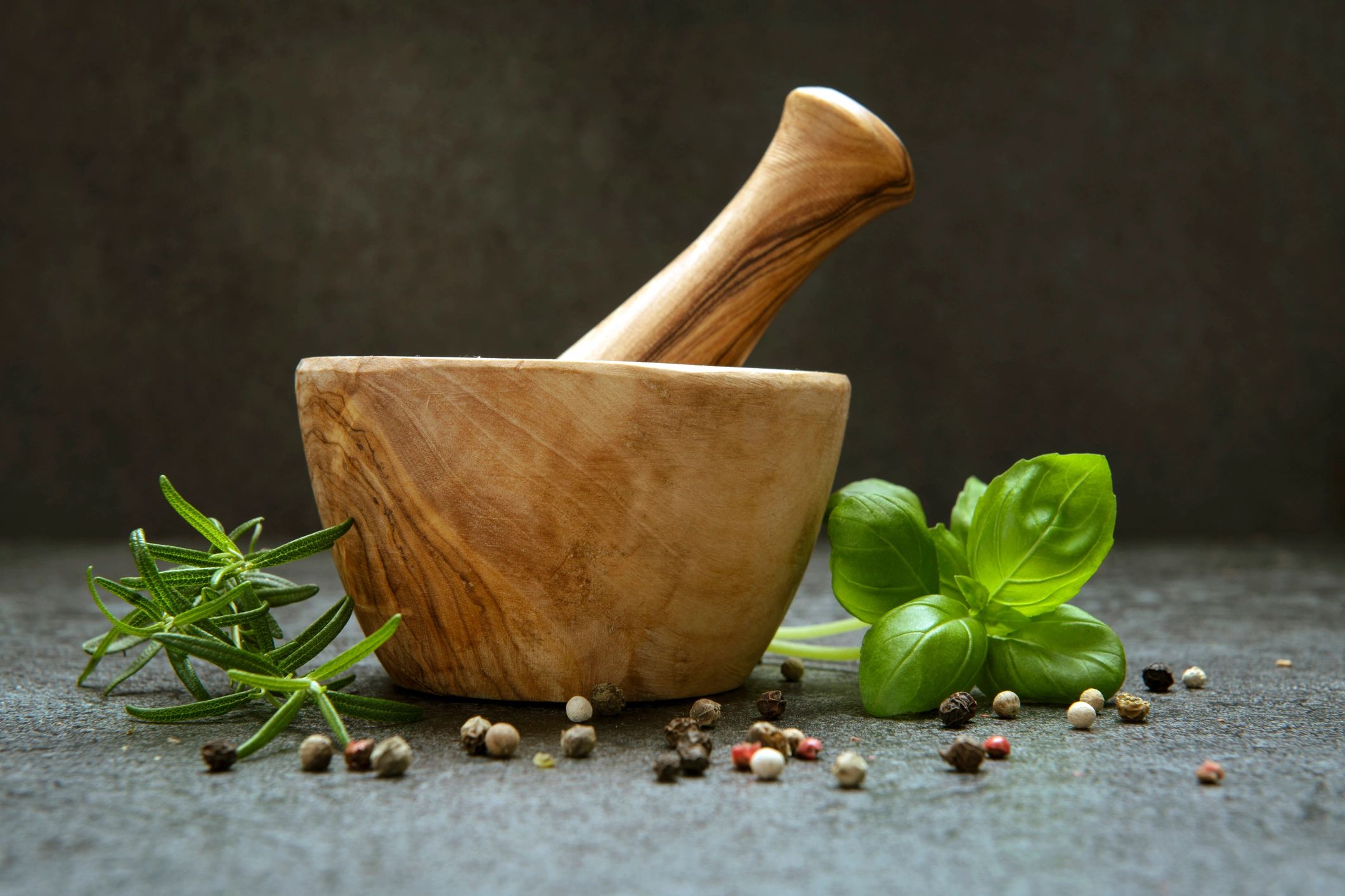 Mortar and pestle with fresh herbs